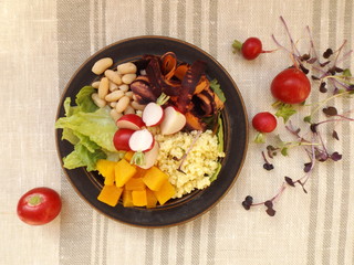 Bowl of Buddha. Vegetarian food, millet, beans and raw vegetables