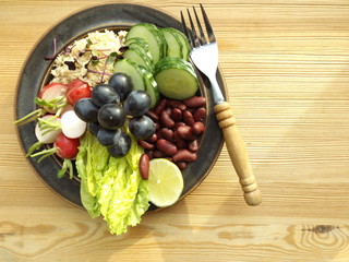 Bowl of Buddha. Vegetarian food, couscous, beans and raw vegetables
