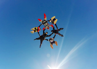 Sky diving group formation low angle view - 140691128