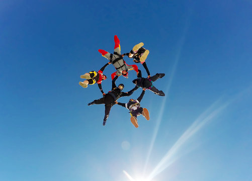 Sky diving group formation low angle view