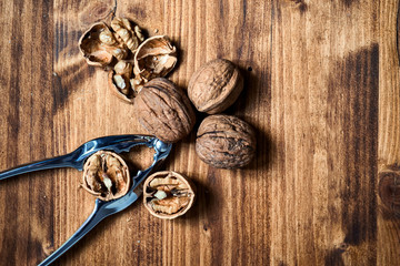 Walnuts and cracker on wooden table