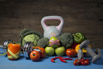 Healthy lifestyle concept. Workout and fitness dieting, Vegetables, dumbbells