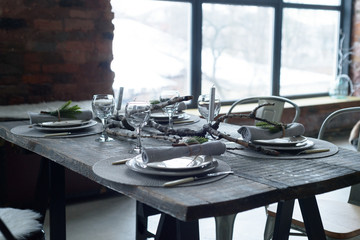 Table setting on a table of natural wood