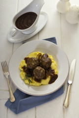 Meatballs with gravy on mashed potatoes