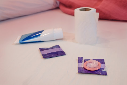 Condom / View of condom on the bed. Sexual concept.
