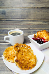 Cheese pancake with coffee and jam