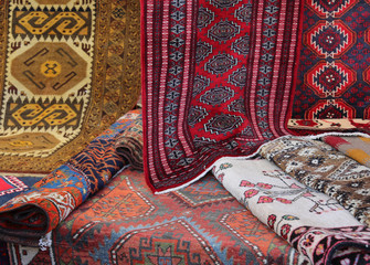 many carpets of different quality on sale in the market