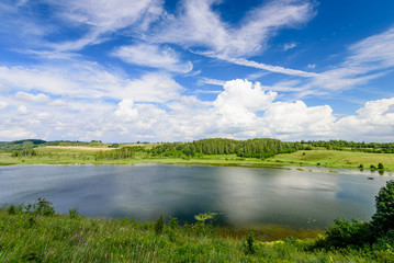 Traditional Russian nature in summer. Picturesque lake Gorodischenskoe, Old Izborsk, Pskov, Russia.