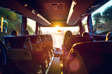 Fotobehang Bus innen Busreise in den Sonnenaufgang – Tour bus interior © Petair