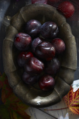 Fresh plums on wooden table 