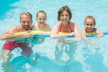 Fototapeta premium Happy parents and kids in pool