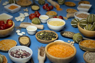 Various dried legumes in bowls for background, Raw legume on old rustic wooden table, Healthy protein food,