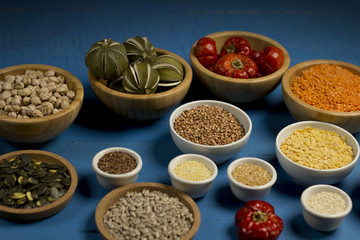 Various dried legumes in bowls for background, Raw legume on old rustic wooden table, Healthy protein food,