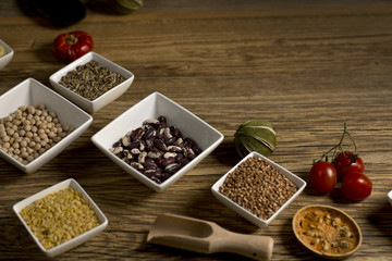 Various dried legumes in bowls for background, Raw legume on old rustic wooden table, Healthy protein food,