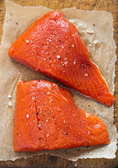 Raw salmon fillets seasoned 