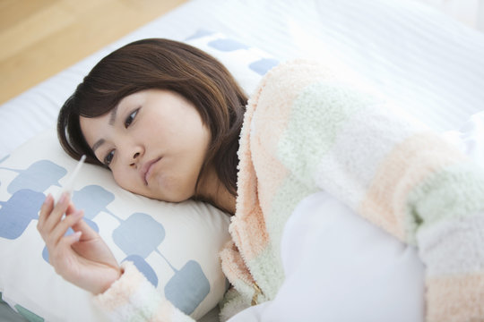 Young Woman Ill with Fever