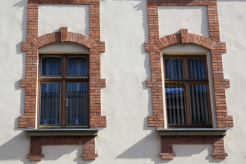 Obraz premium Two vintage front glass windows of an old house