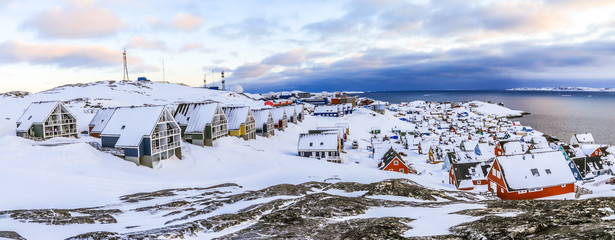 Inuit houses covered in snow. Nuuk city spring panorama, Greenland © vadim.nefedov