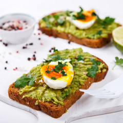 Avocado Vegetable. Sandwiches with Guacamole ,Egg and Parsley on a White Background.Appetizer.Food or Healthy diet concept.selective focus.