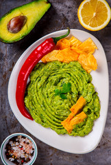 Avocado, Vegetable.Guacamole is a Traditional Mexican Sauce with Nachos.Food or Healthy diet concept.Copy space for Text. selective focus.