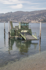 Fototapeta na wymiar Industrial barge floats on the Como lake