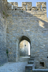 Fototapeta na wymiar Imposing gateway. The fortress of Carcassonne and its great walls and gates.