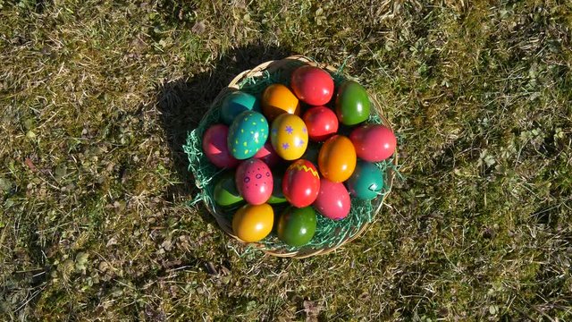 Bee is flying over a basket of ester eggs