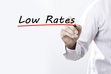 Businessman hand writing Low Rates, Business concept.
