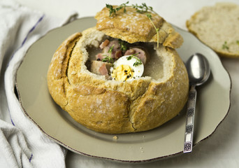 Zurek polish rye soup served in loaf of bread