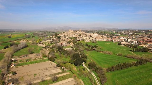 Medieval Gothic Stone Town Aerial Drone View.
Pals has a historic centre on a hill surrounded by plains with a medieval Romanesque tower. The Gothic Quarter of the town has been restored.