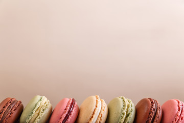 Macaroon cakes. Different types of macaron. Colorful almond cookies. French sweet dessert.