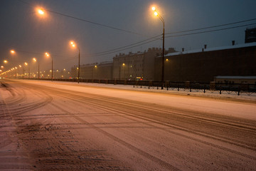 Fototapeta na wymiar Night street covered with snow