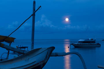 Traditional Indonesian wooden fishing boat at dusk