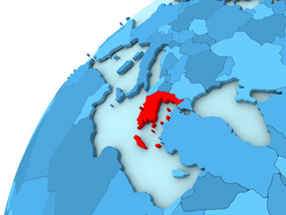 Greece in red on blue globe