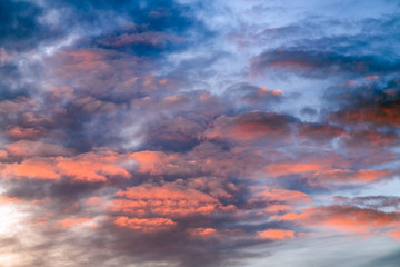 Sky Blue Pink - The setting sun paints a cloudy sky with dramatic and colorful tones.