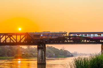 Obraz premium The train is passing through the Death Railway Bridge over the River Kwai in Kanchanaburi.During World War Two Japan constructed railway from Thailand to Buma This is now know the Death Railway.