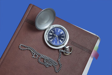 Pocket watch on diary page - 140729730