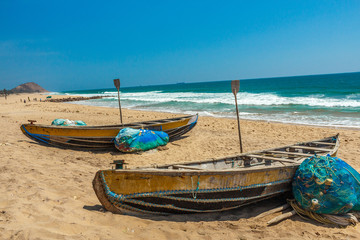 Wide view of group of fishing boats parked in seashore with sea background, Visakhapatnam, Andhra...