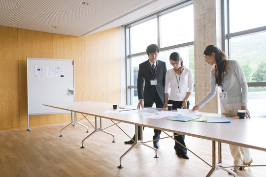 Business people looking at documents