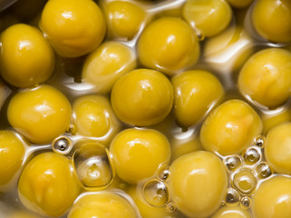 Canned green peas as a background