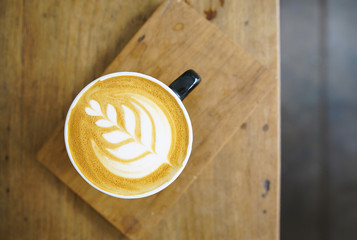 Hot coffee on wooden table. coffee Latte art