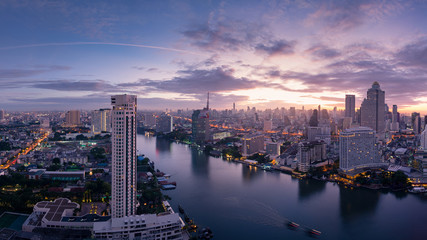 Bangkok downtown, Chaophrya river, hotels and condominium with sunrise mood.