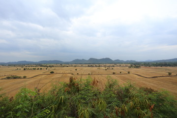 Fototapeta premium Field with mountain, Wat Tham Sua(Tiger Cave Temple) Kanchanburi, Thailand