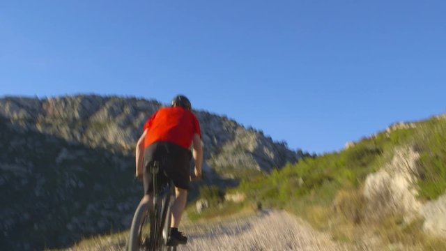 Mountain Biking - Sequence of four shots of a mountain biker who is driving on a trail - ProRes
