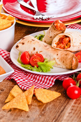 Tortilla wraps with chicken and vegetable. 