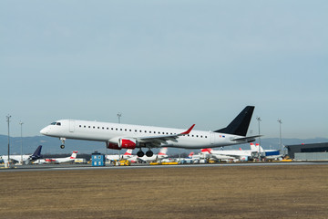 Fototapeta na wymiar Landing and taxiing aircraft at the airport Vienna Austria Europe