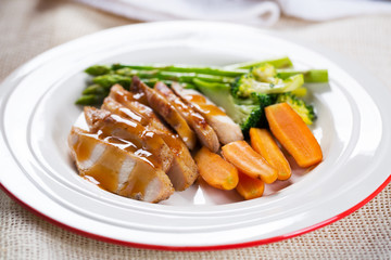 grilled chicken with sauce and vegetable