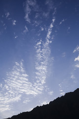 A Blue Sky With Clouds Above Mountain range