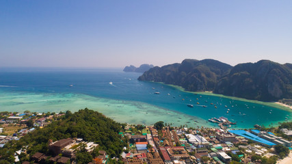 Aerial drone photo of Andaman sea and limestones, shot done behind iconic tropical beach and resorts of Phi Phi island, Thailand