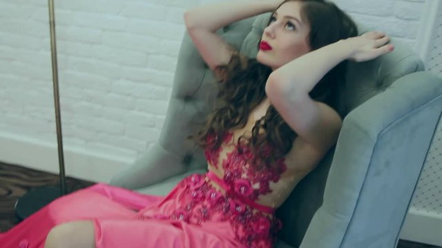 young girl sitting in a chair